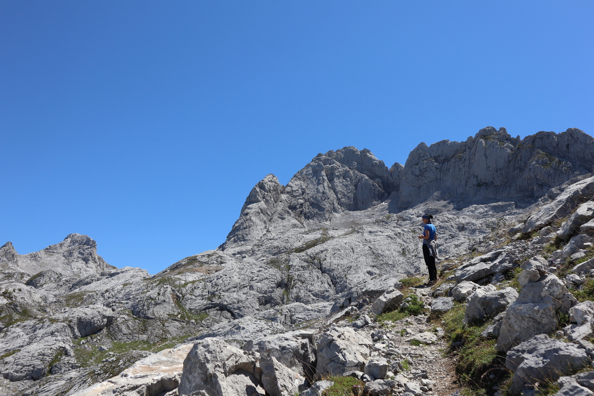 Girl climbing a steep rocky slope